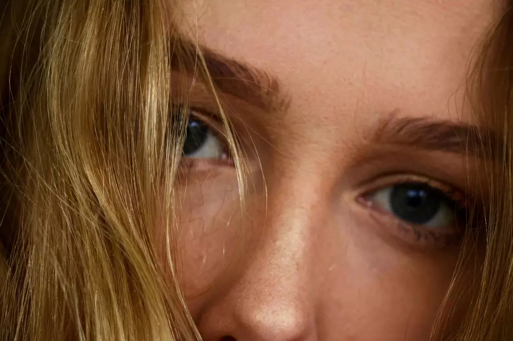 a close up of a person brushing their teeth