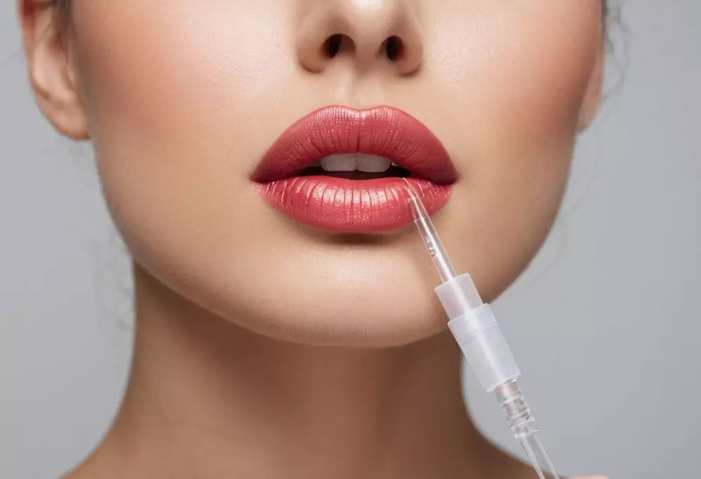 A sleek, modern needleless lip injection device placed elegantly on a clean, white surface, under soft, studio lighting, photographic style with sharp focus.