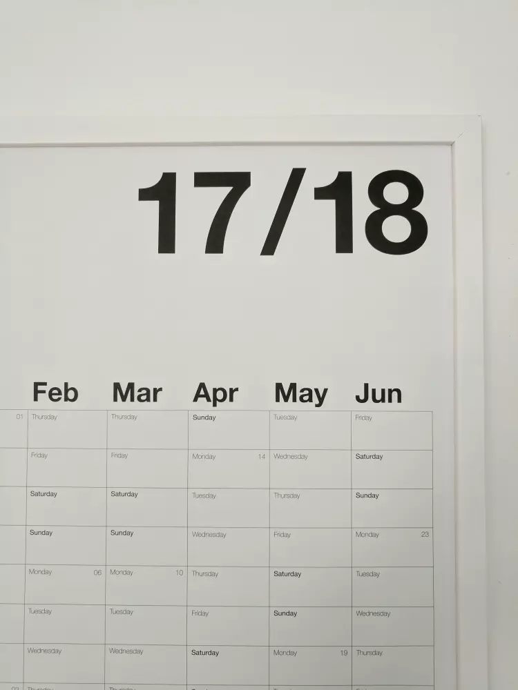 a white calendar with black numbers on it