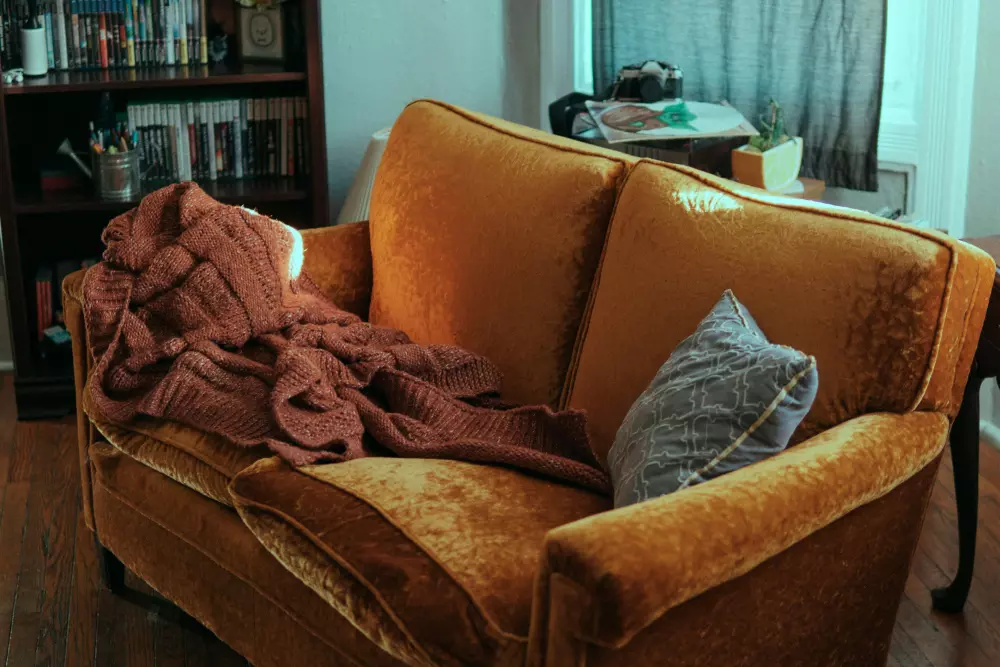 a couch with a blanket on top of it