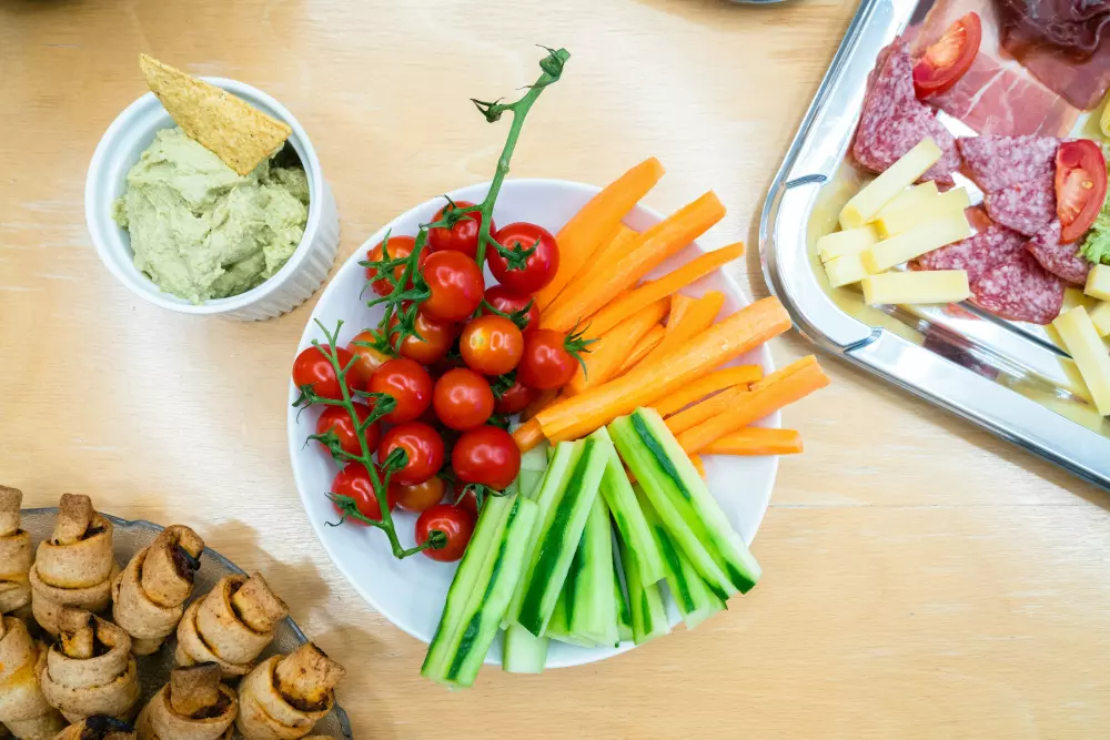 A plate of vegetables and meat on a table