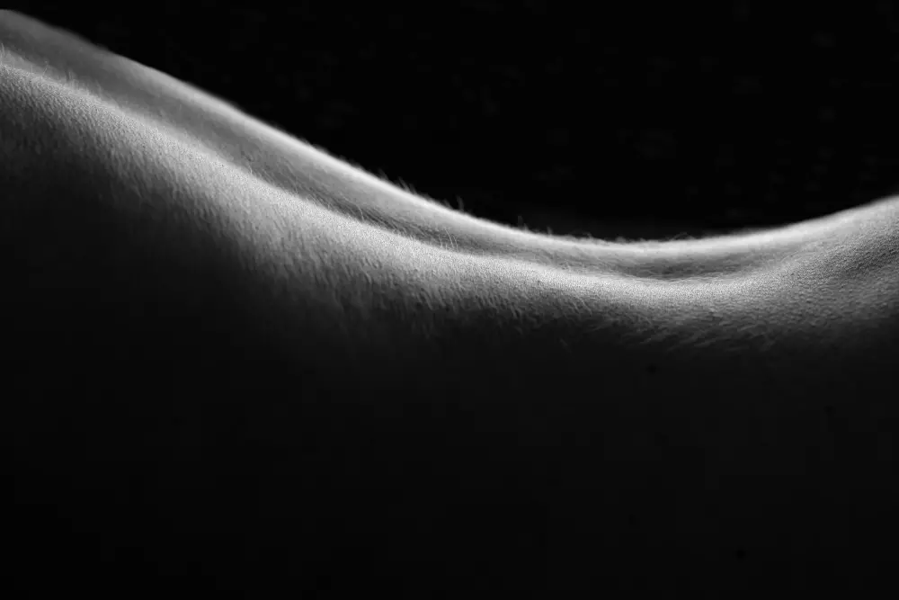 A black and white photo of a person's back