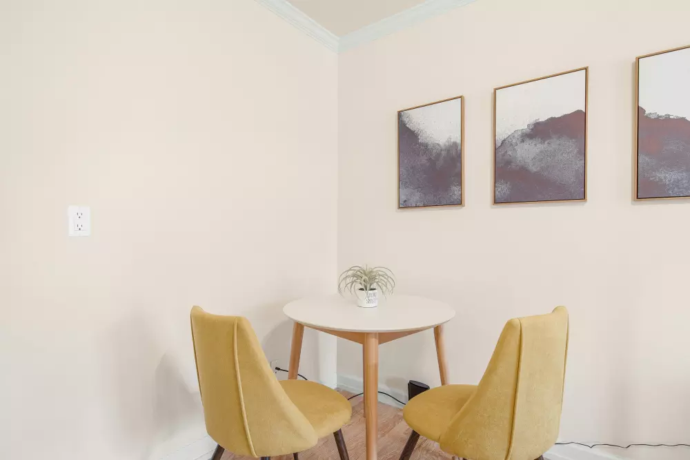 Two chairs and a table in a room